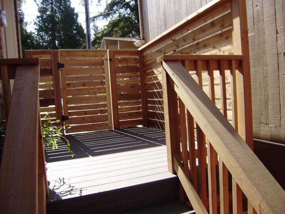 A wooden deck with stairs leading up to it