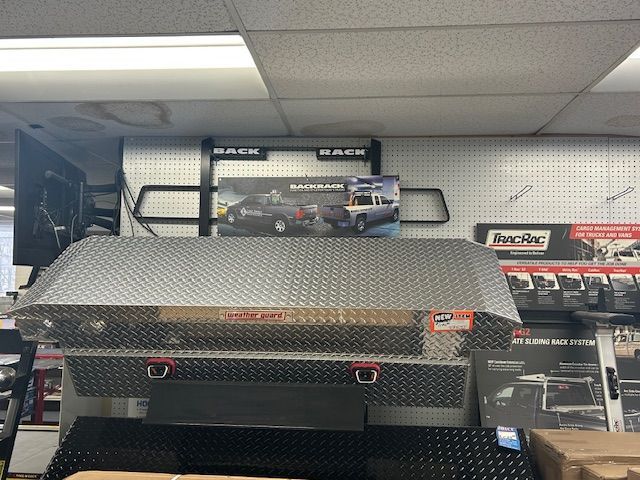 A metal box is sitting on top of a table in a store.