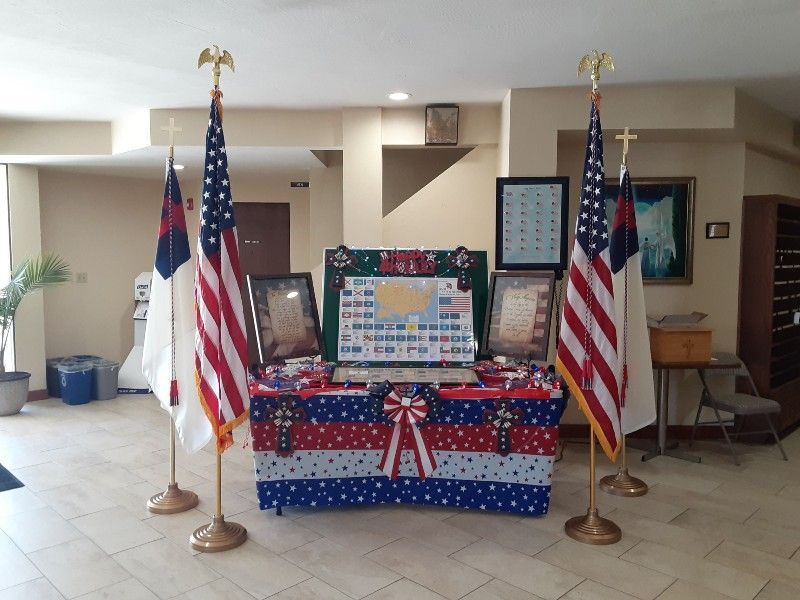 A table with american flags on it in a room