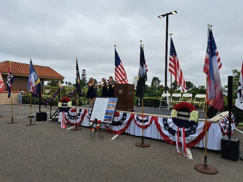 A stage with a podium and flags on it