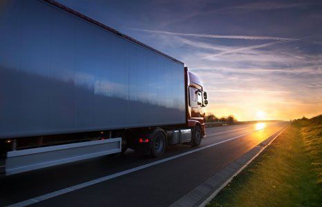 Moving truck on a sunset