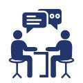 Two people sitting at a table having a conversation, represented by speech bubbles.