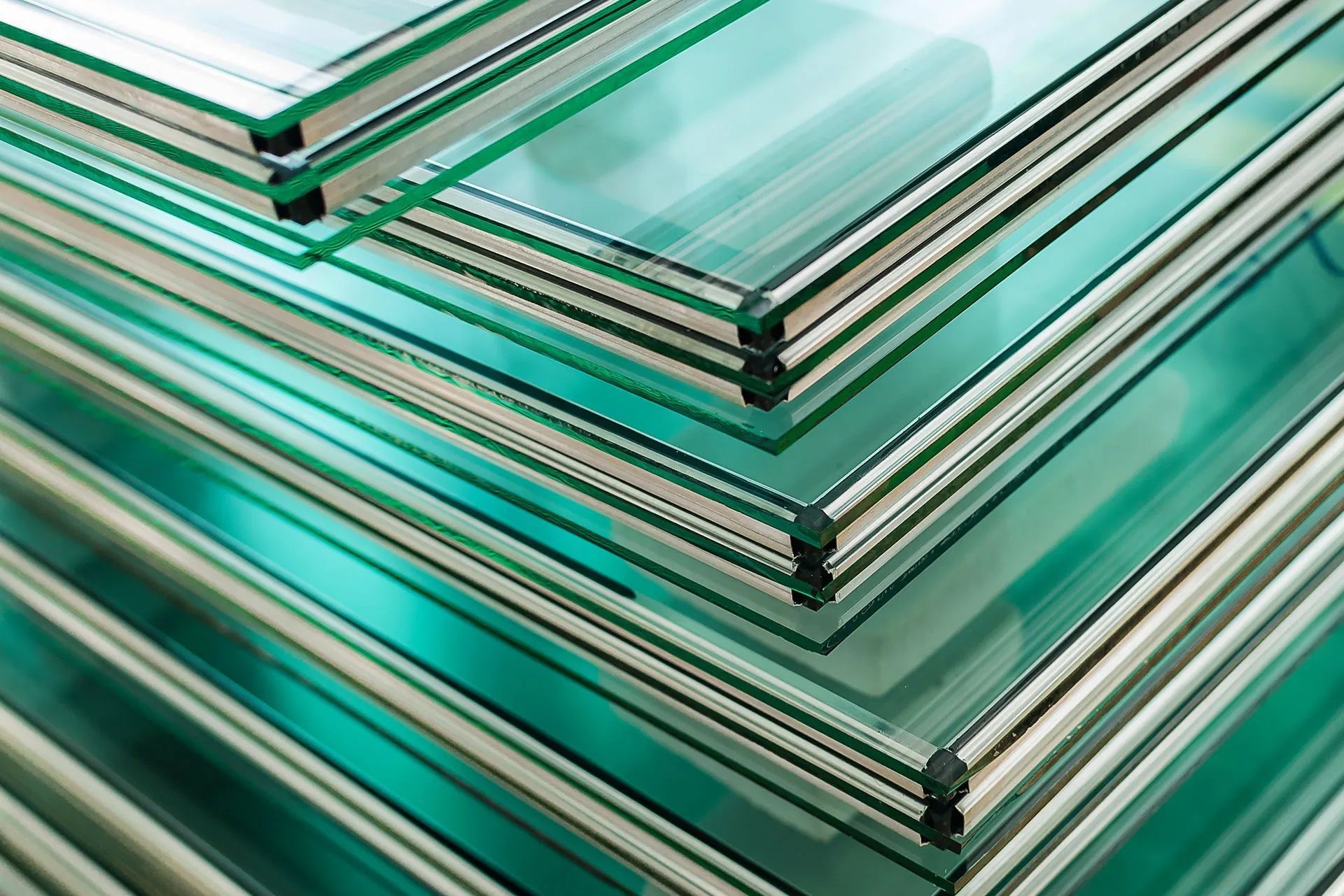 A stack of green glass sheets sitting on top of each other.
