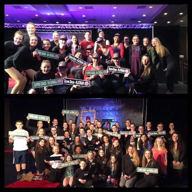 A group of people are posing for a picture and one of them is holding a sign that says save the soul