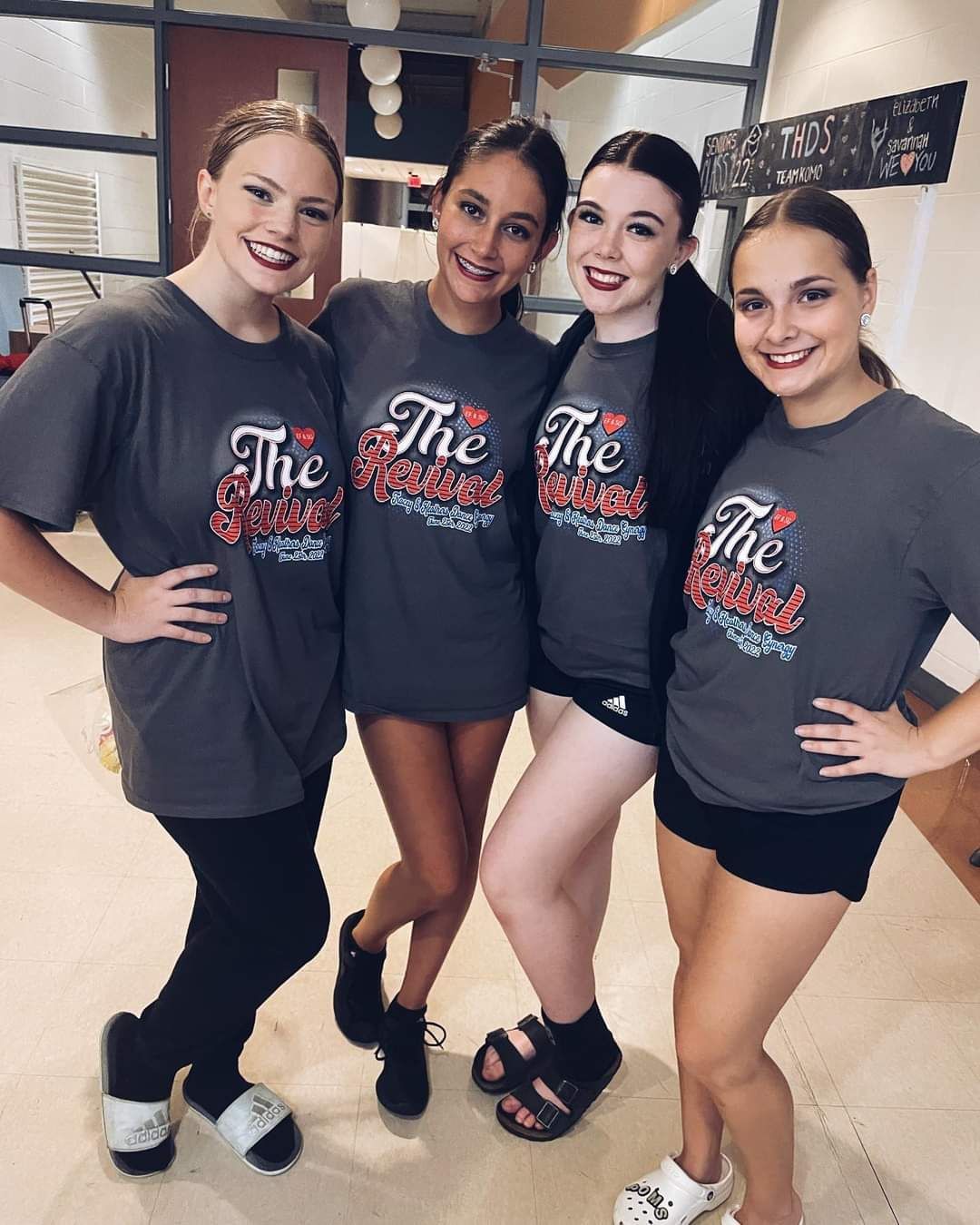 A group of young women are posing for a picture together.