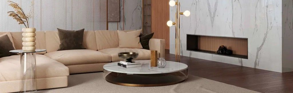 Luxurious living room with marble walls, beige couch, coffee table, and fireplace.