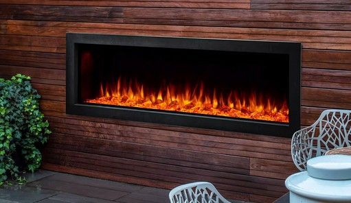 Modern electric fireplace with orange flames and faux logs, encased in dark gray structure.