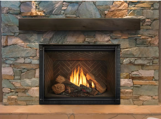 Fireplace with stone surround, lit fire, dark wood mantel.