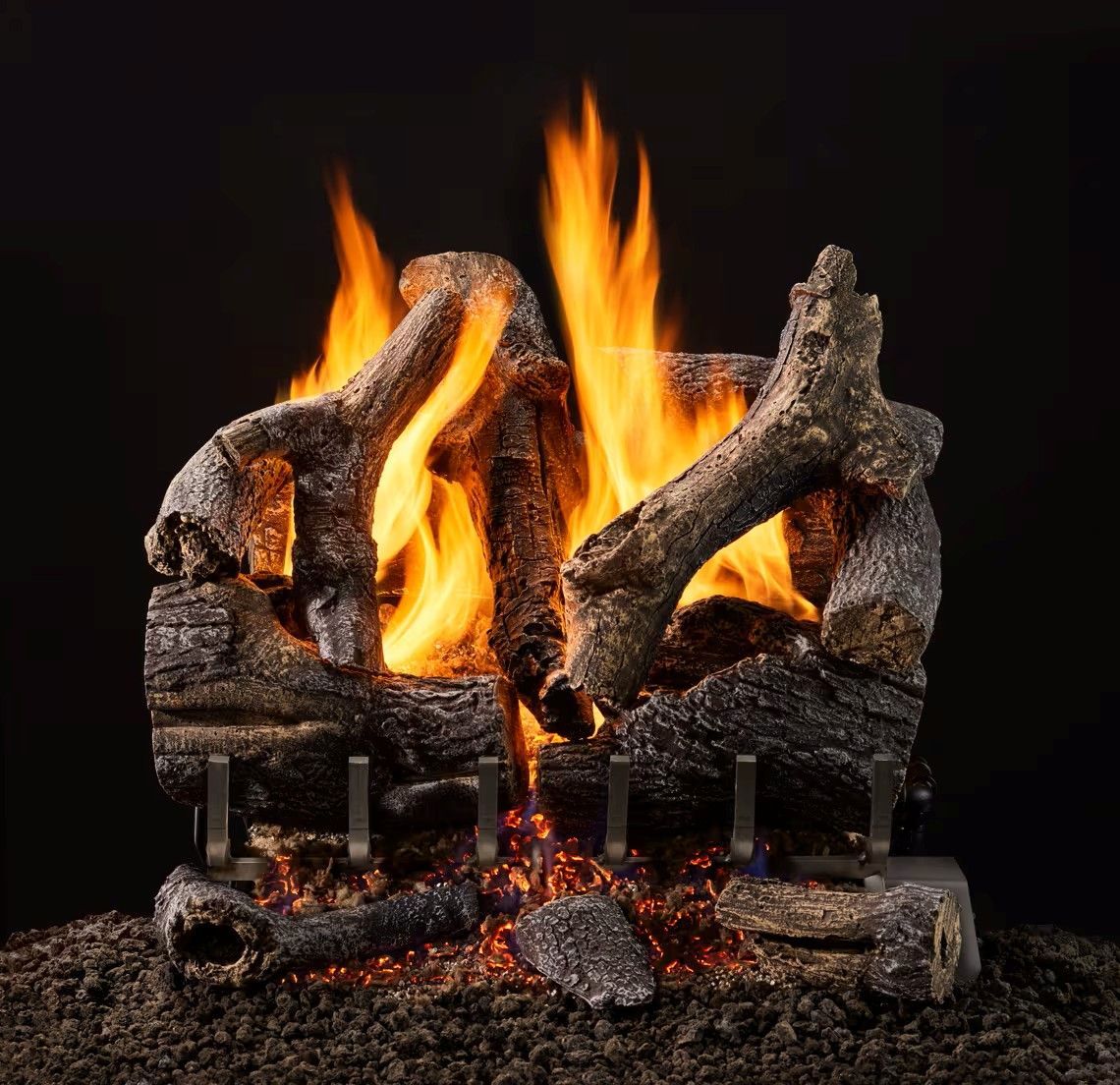 Burning gas fireplace log set, with flames and ceramic logs.