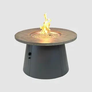 Round gray fire pit with a lit flame, set on an outdoor patio.
