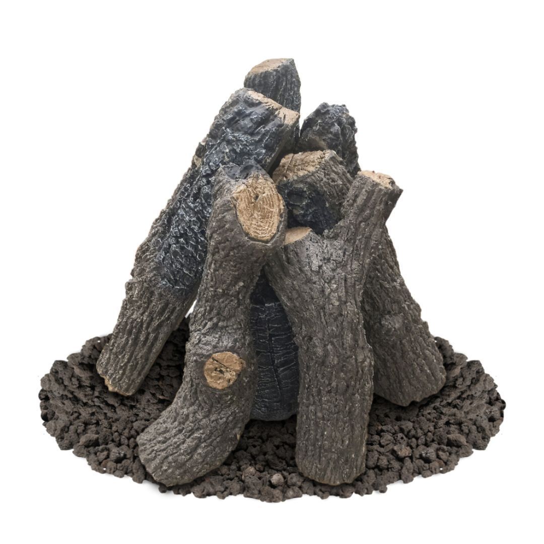 Ceramic fireplace logs arranged on a bed of dark lava rocks.