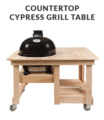 Cypress grill table with a black grill on top. Table has a lower shelf and is on wheels.