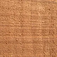 Brown cork flooring, with a textured, natural appearance.