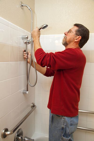 Plumber working on shower heads