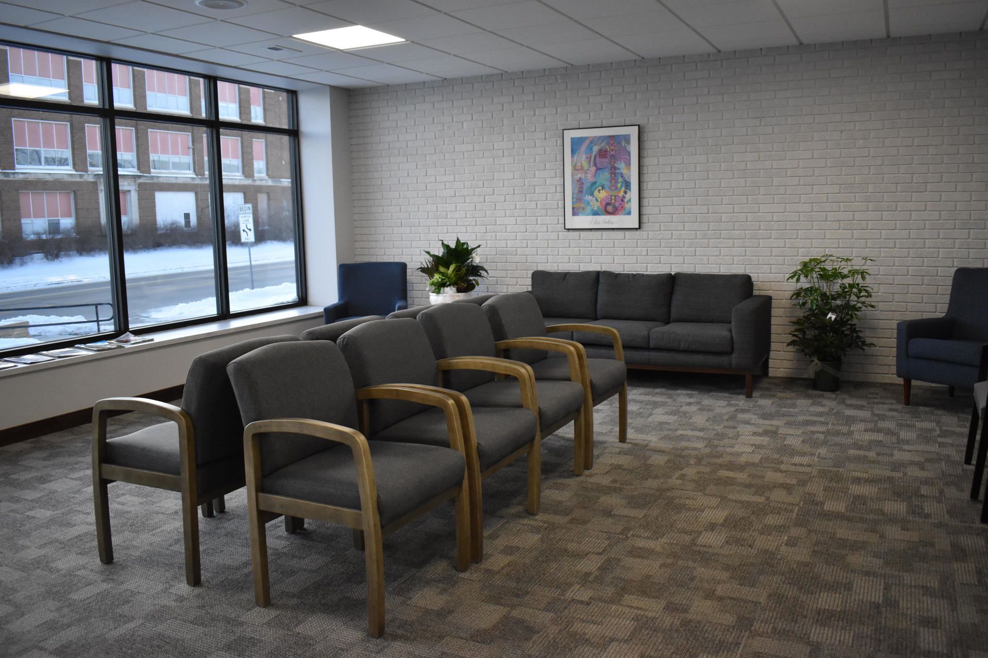 Learn More About Us Man and woman looking at xray