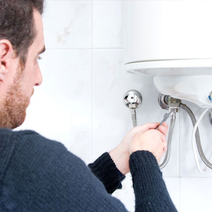 Learn More About Water Heater Plumber Fixing Water Heater