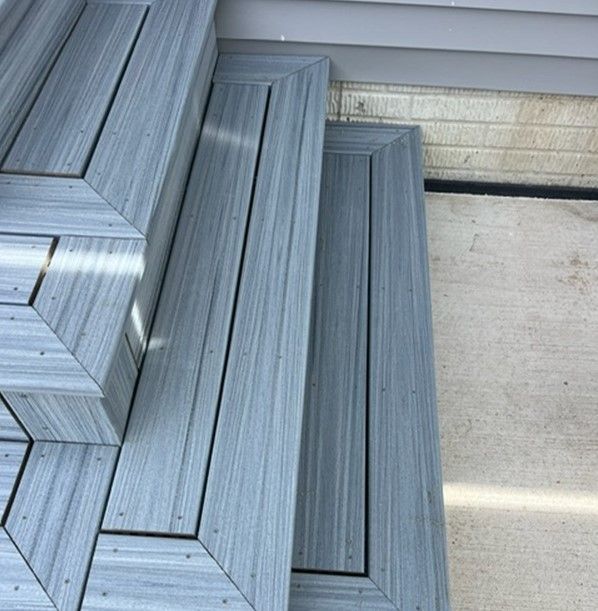 A close up of a set of stairs made of wood