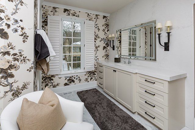A bathroom with two sinks and a large mirror