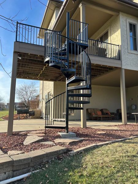 A house with a spiral staircase leading up to the second floor