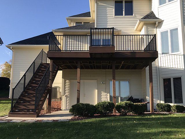 The back of a house with a deck and stairs