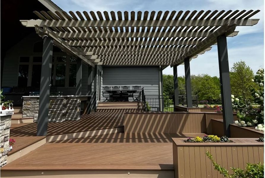 A wooden deck with a pergola over it