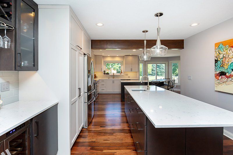 There is a large island in the middle of the kitchen.