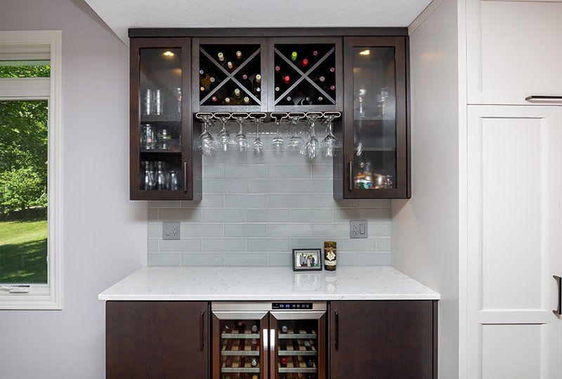 A kitchen with a wine rack and a wine cooler.