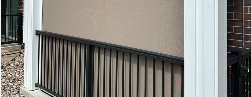 A close up of a fence on the side of a house.