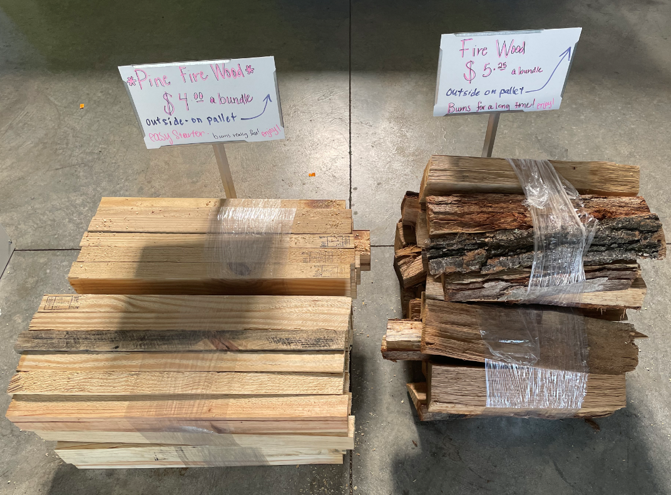 Two piles of wood are sitting next to each other on a concrete floor.