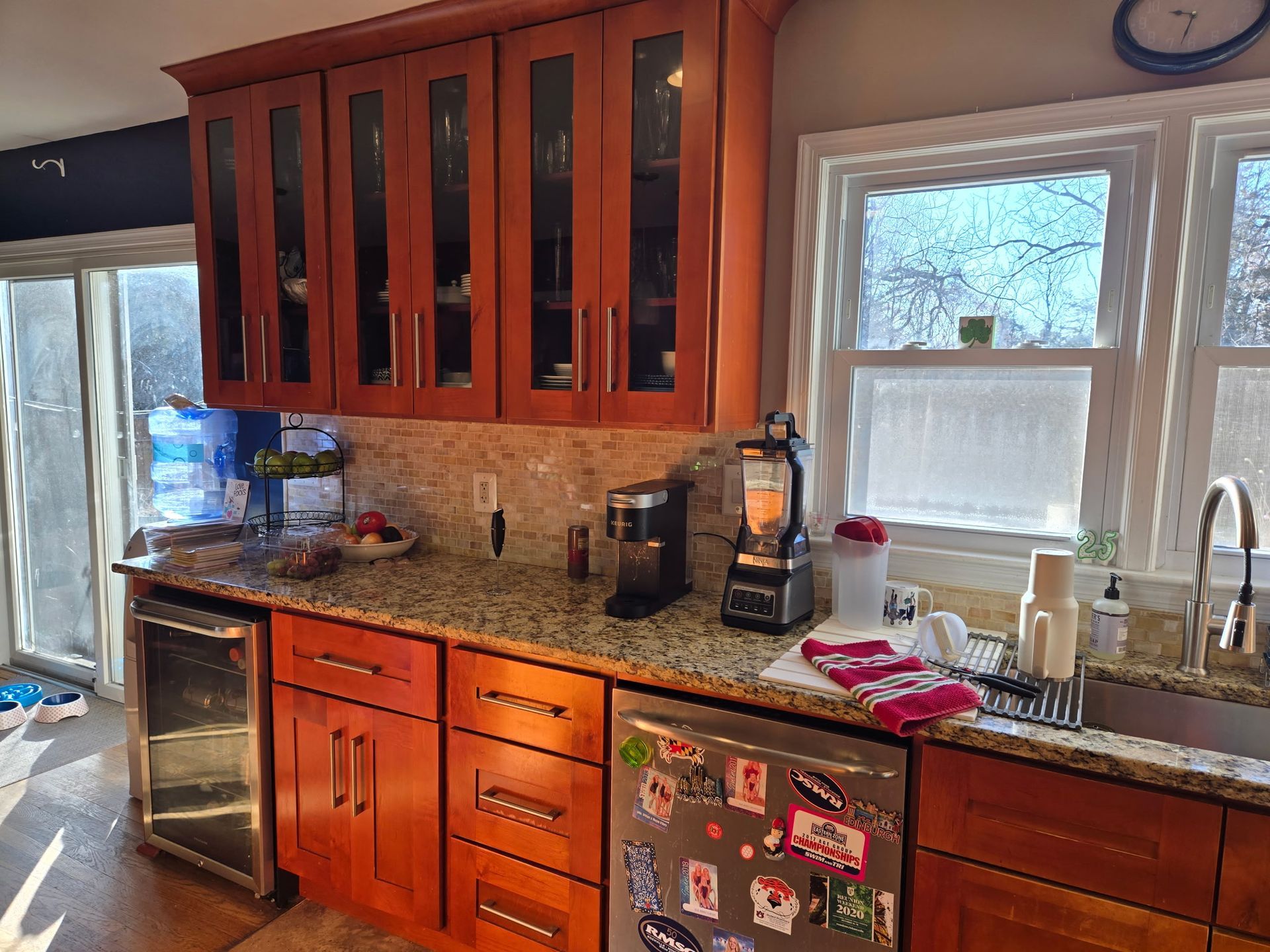 A kitchen with wooden cabinets and granite counter tops