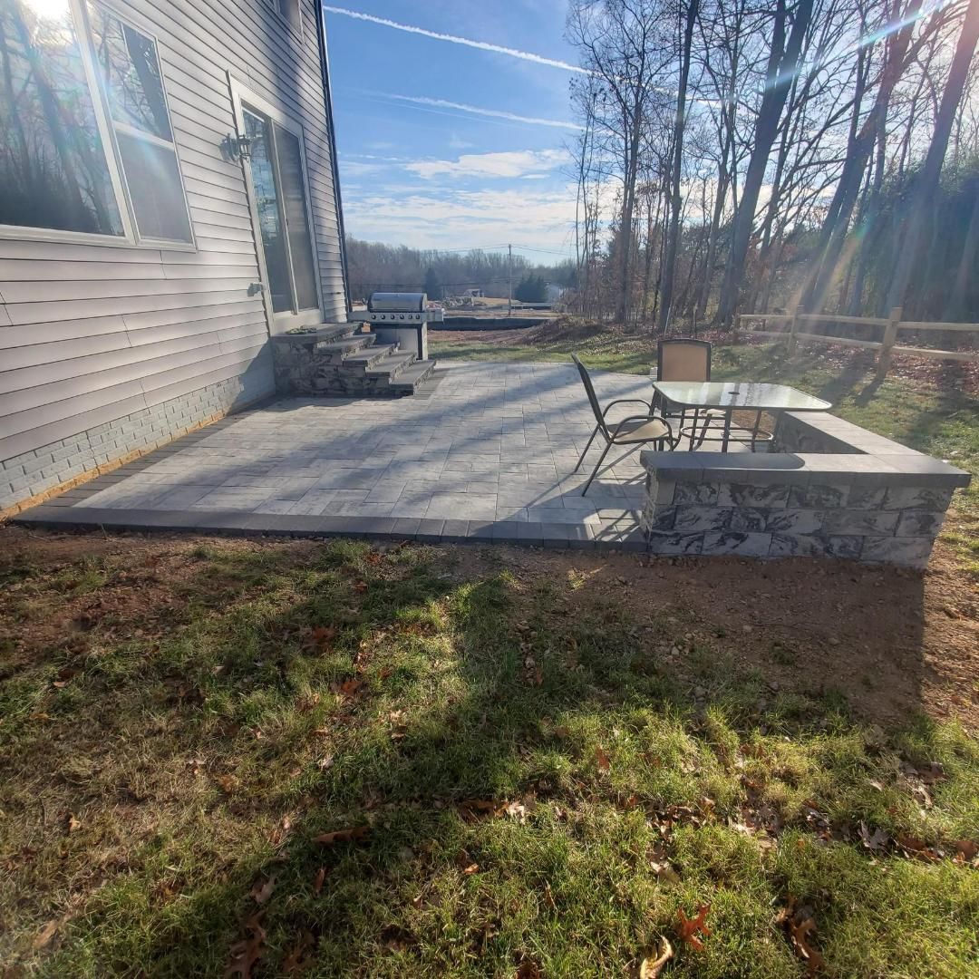 marble blend with charcoal border and hardscape steps/sitting wall
