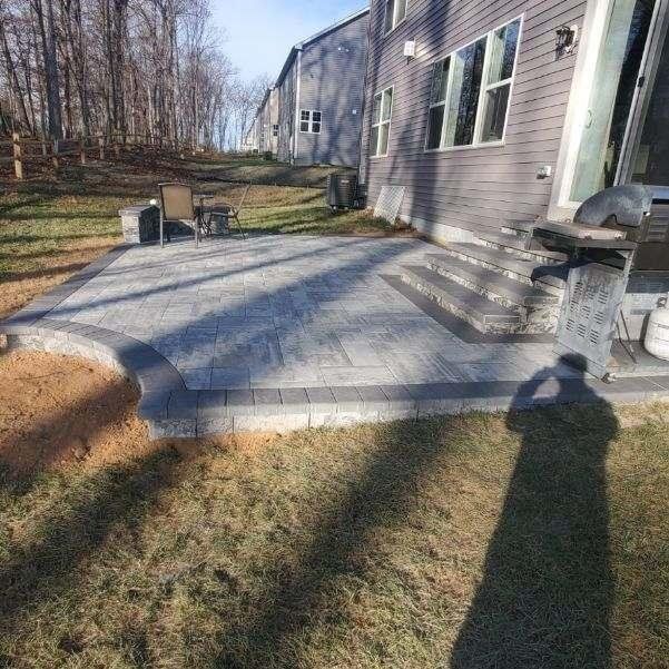 marble blend with charcoal border flooring and hardscape steps/sitting wall