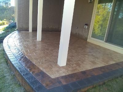 a patio with columns and a sliding glass door