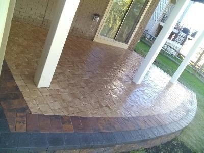 a patio with bricks and a sliding glass door