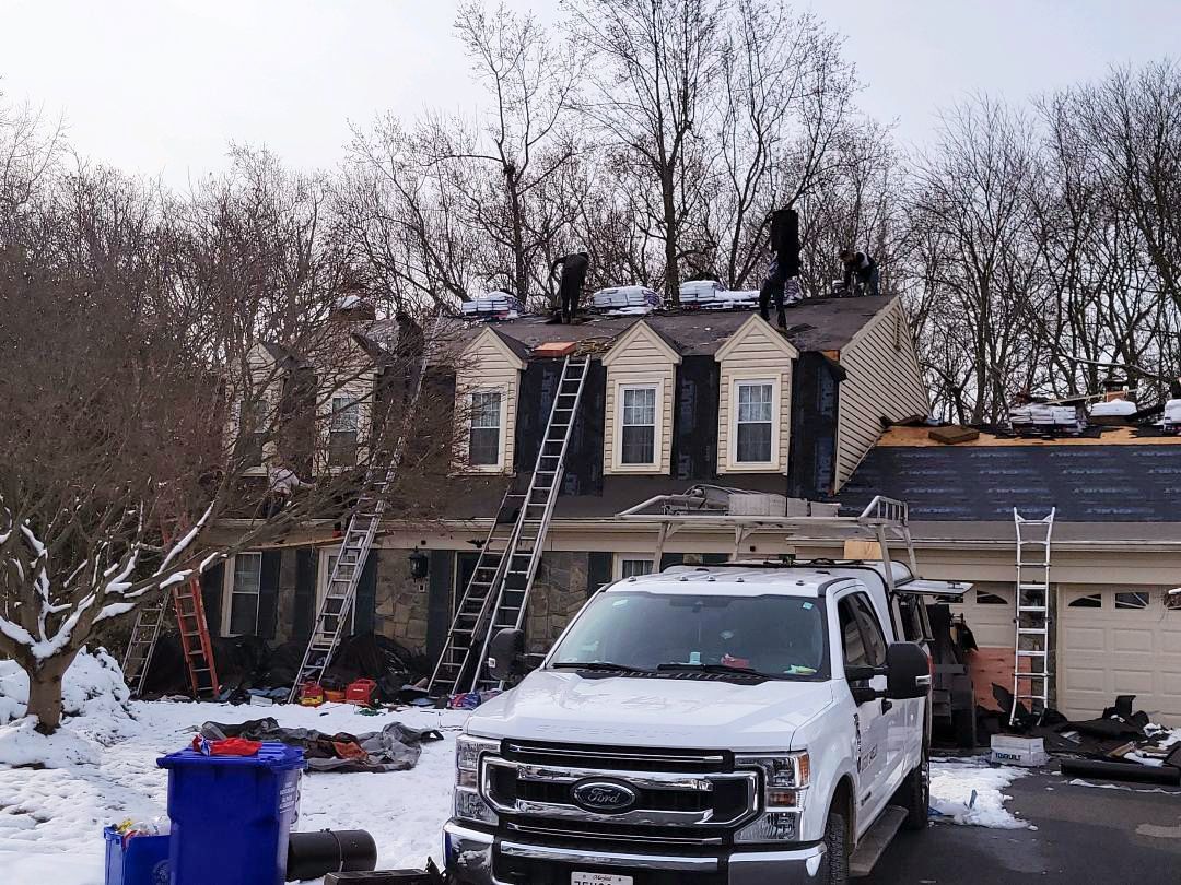 a white truck is parked in front of a house that is being remodeled
