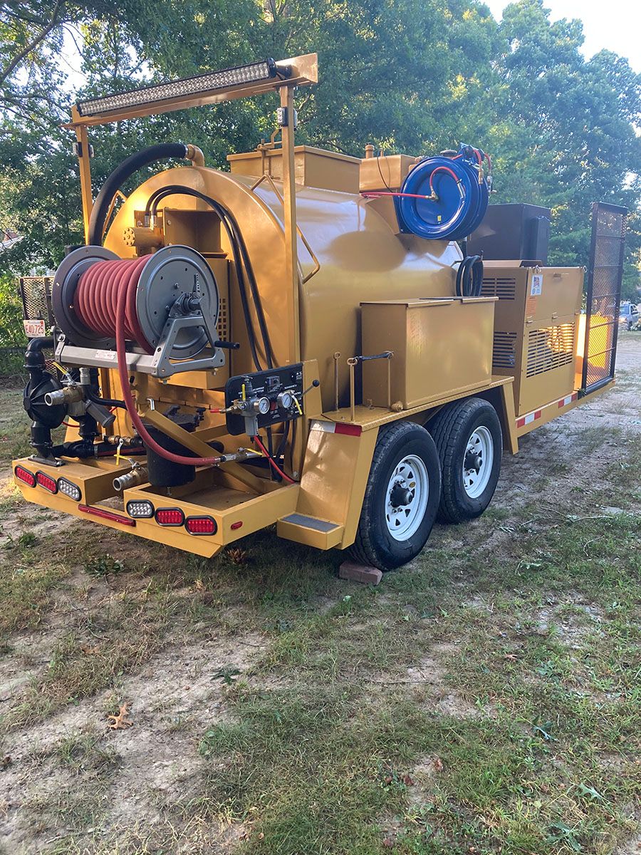 Truck with sealcoat applicator