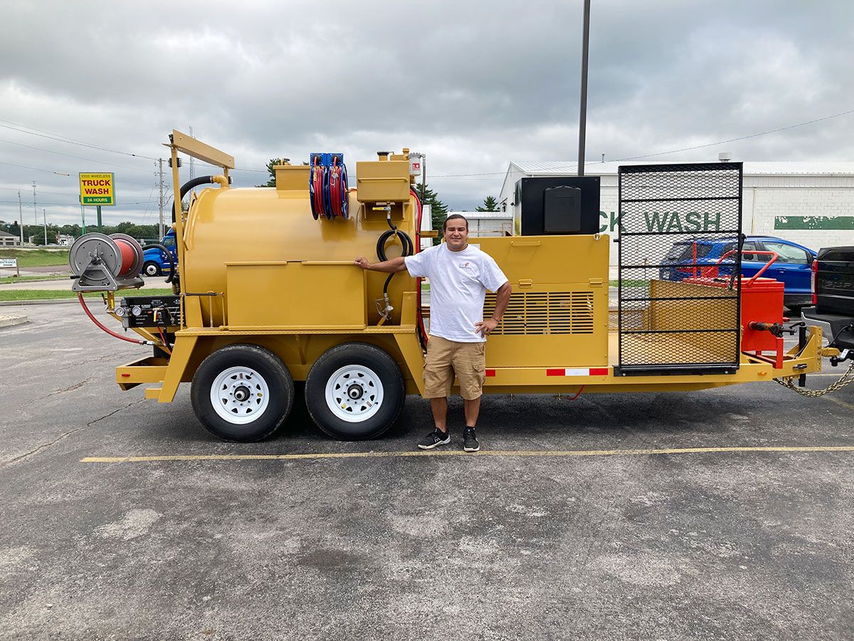 Truck with sealcoat applicator
