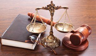 Justice scale, gavel and the law book