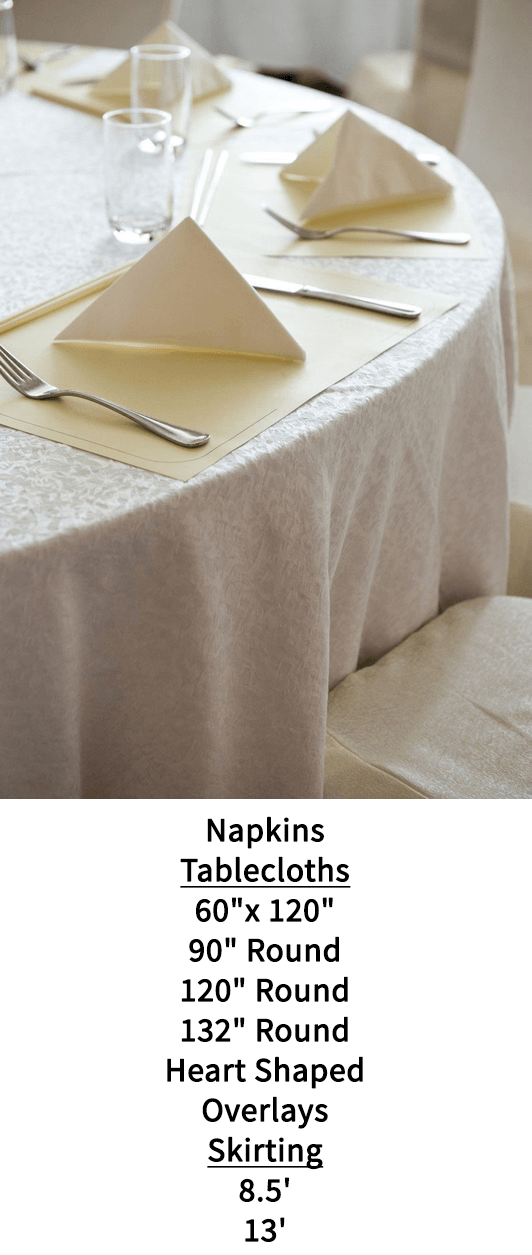 A round table with napkins and utensils on it