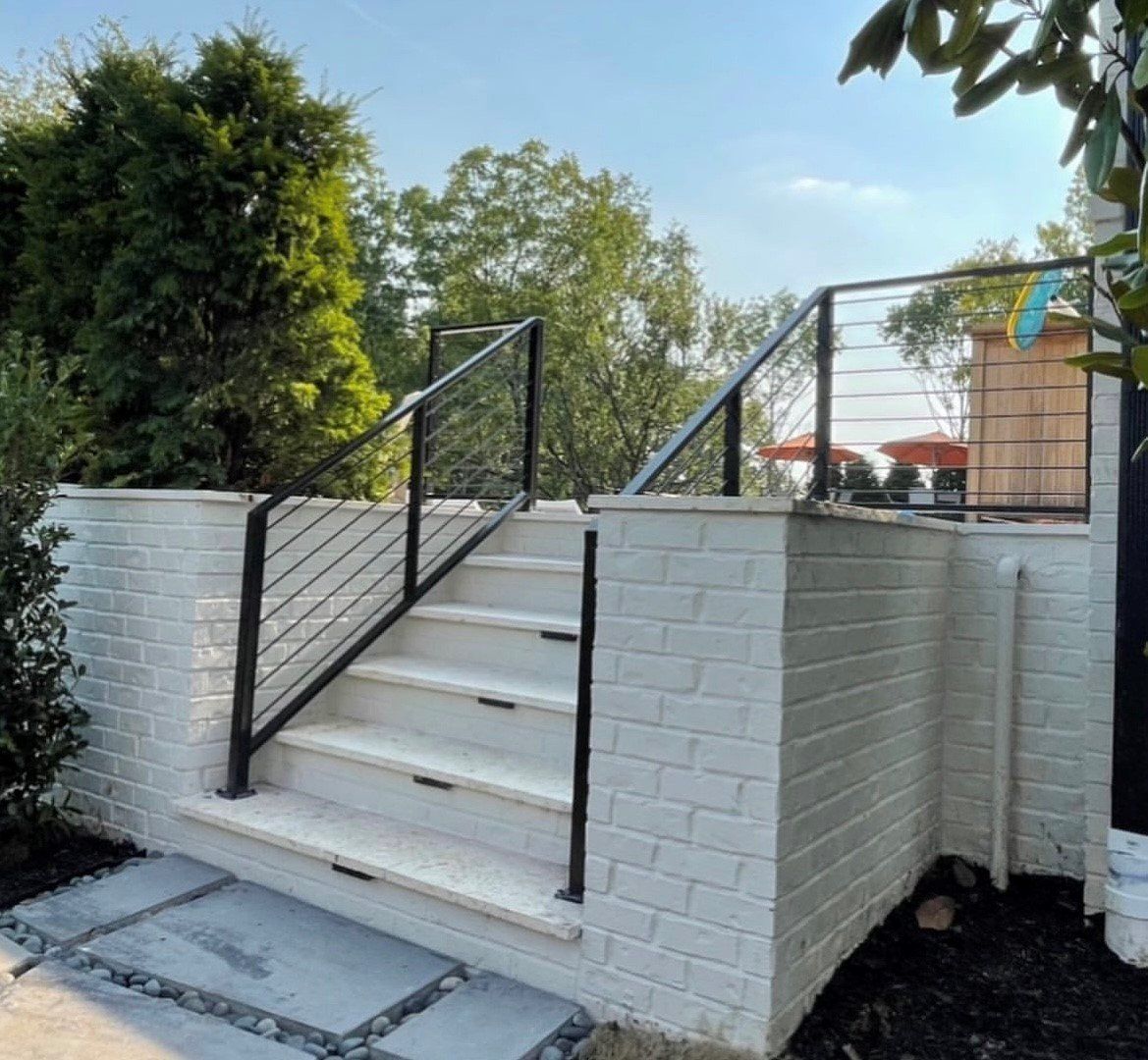 stairs with black railings