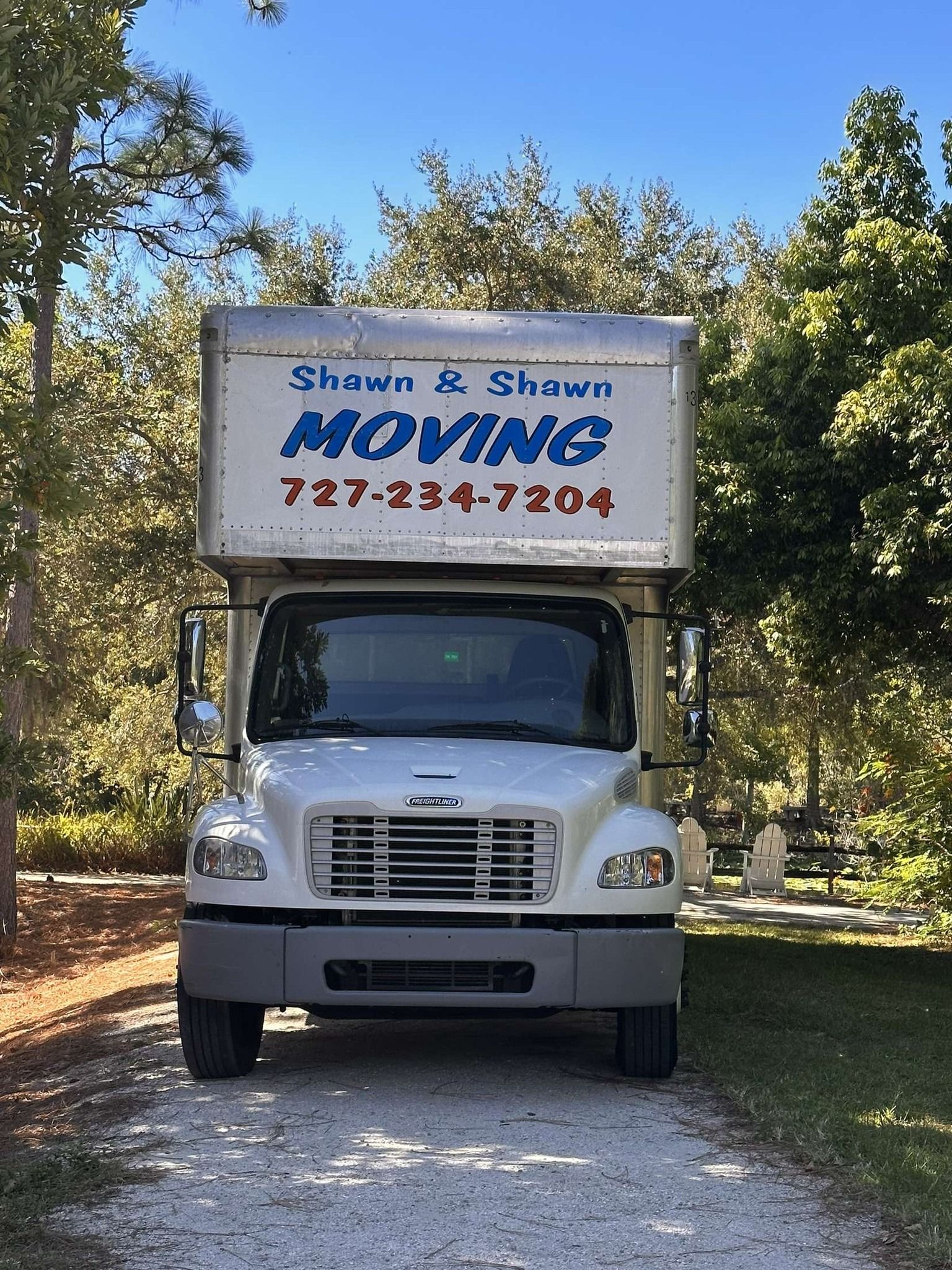 White moving truck with the logo 