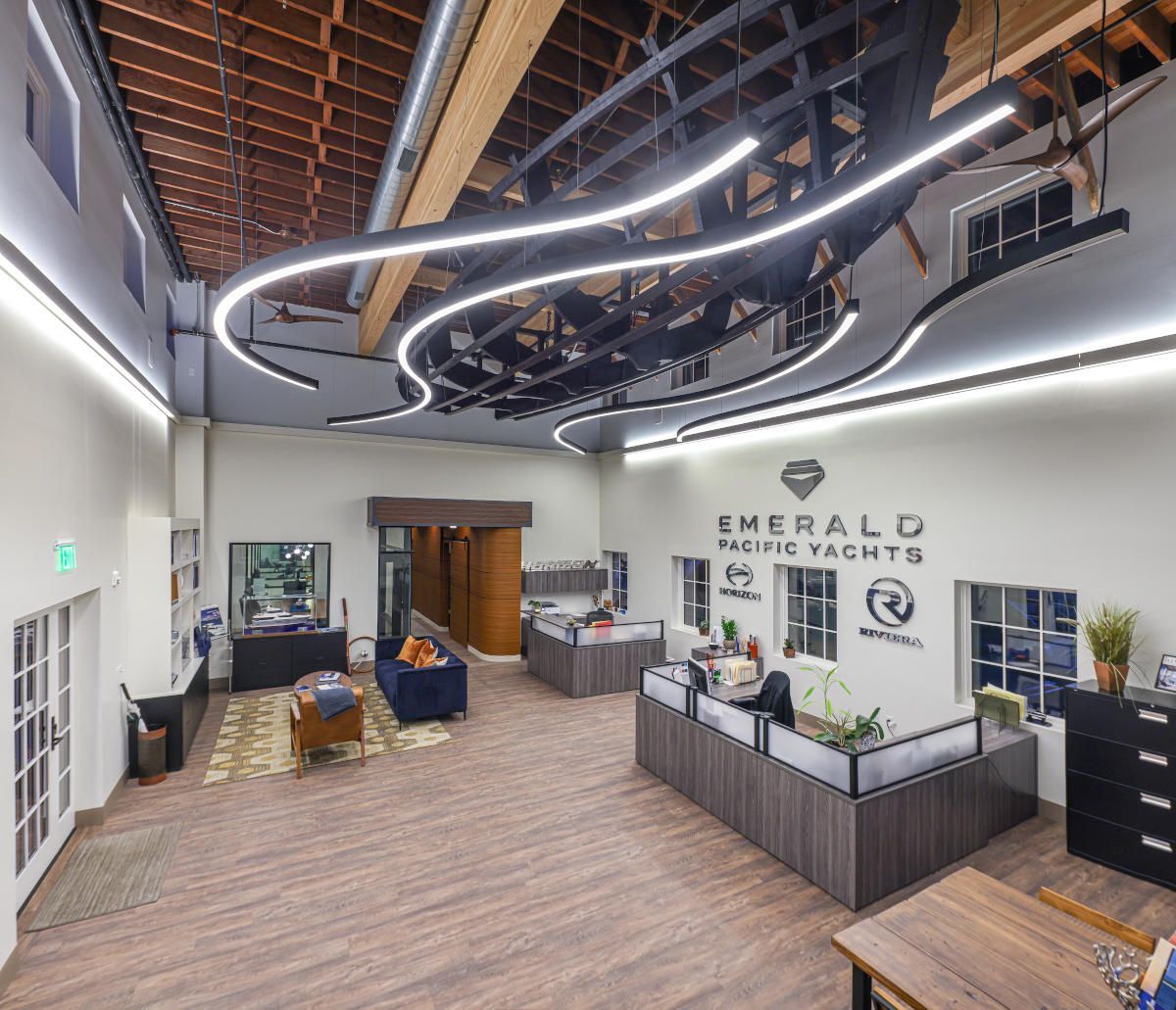 Interior of Emerald House Yachts office with modern lighting and workspace.