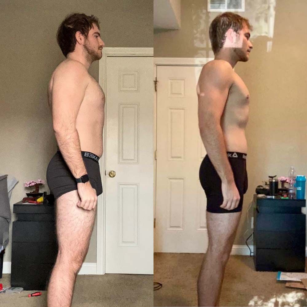 A man without a shirt is standing in a room next to a door