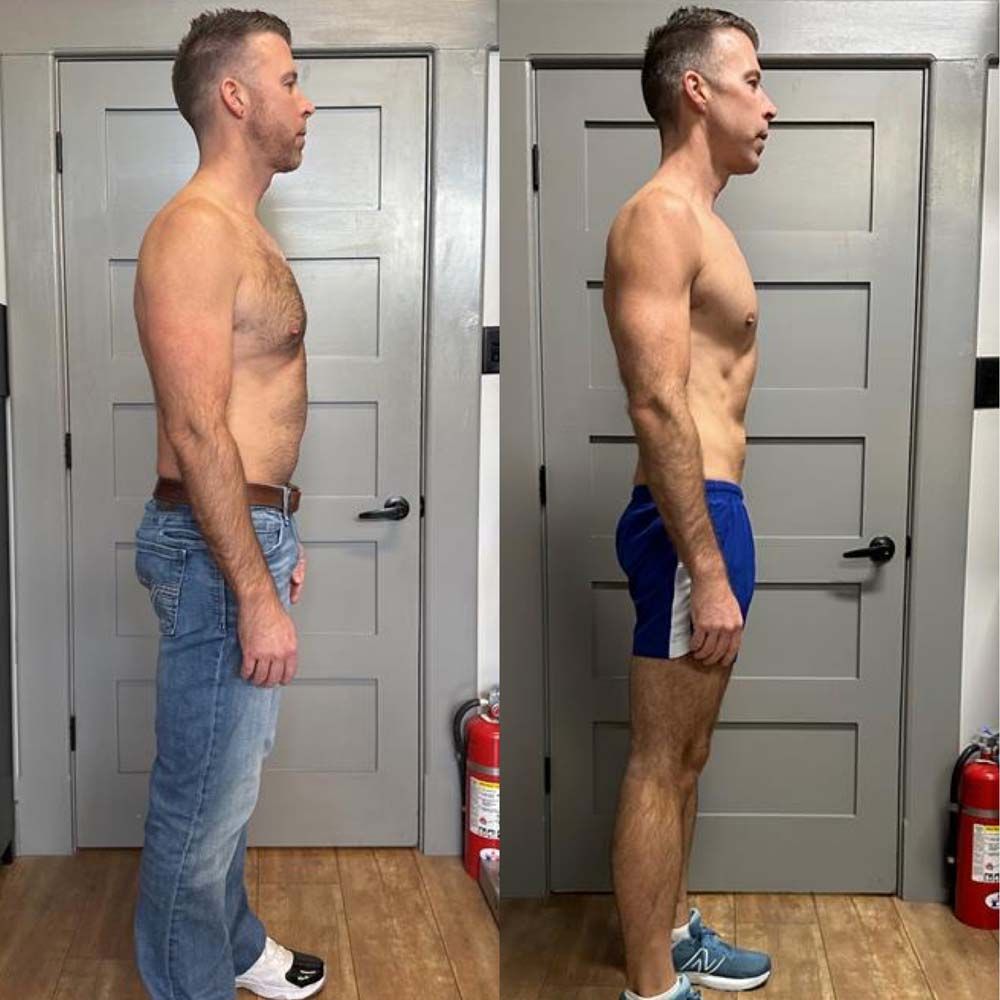 Two men are standing next to each other in front of a door