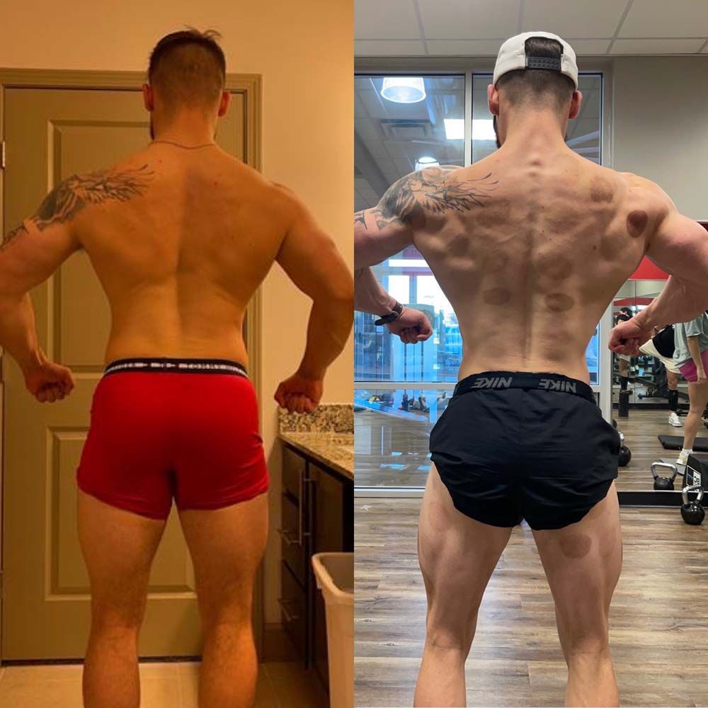 A man in red shorts and black shorts is standing in front of a mirror