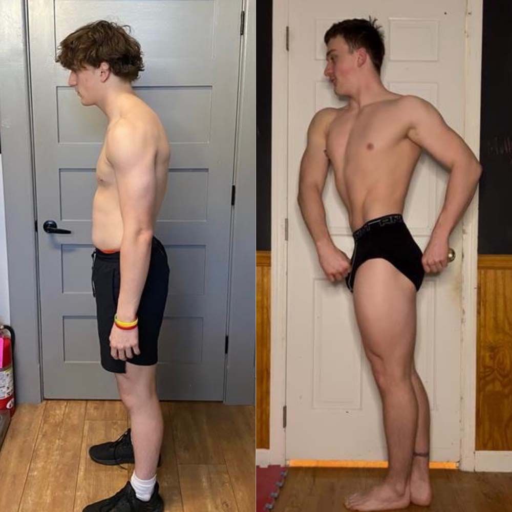 A man without a shirt is standing in front of a door