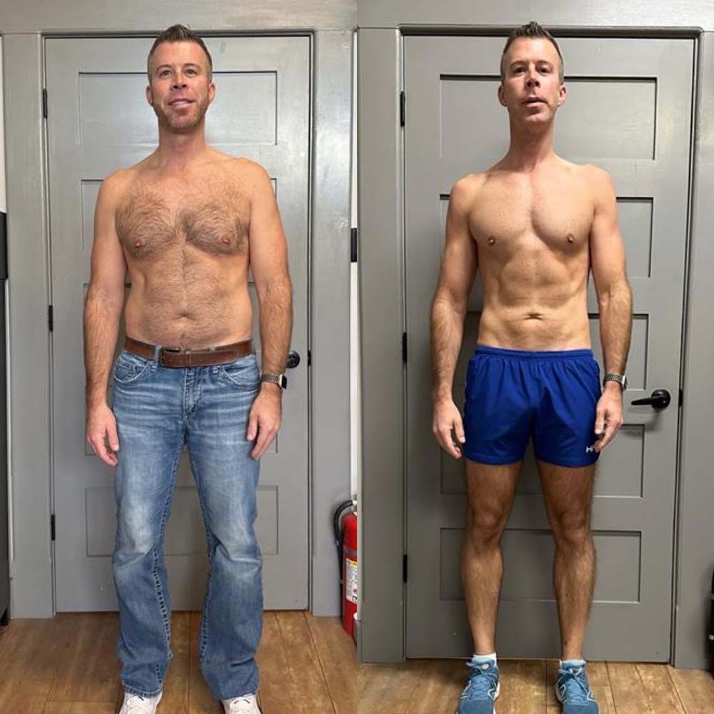 A man without a shirt is standing next to a shirtless man in blue shorts