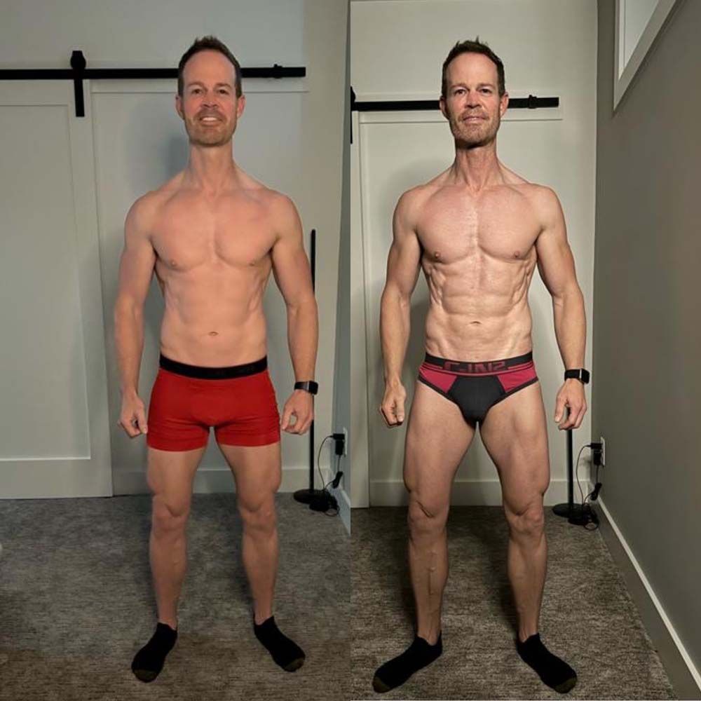 Two men in underwear are standing next to each other in a room