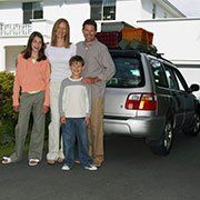 Family in front of their car