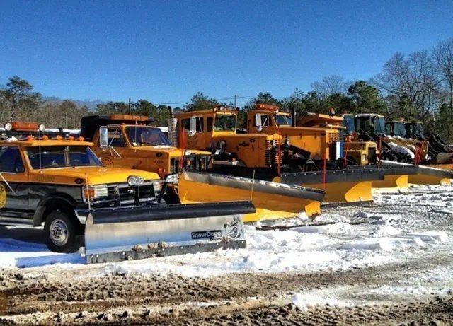 Snow removal vehicle and trucks